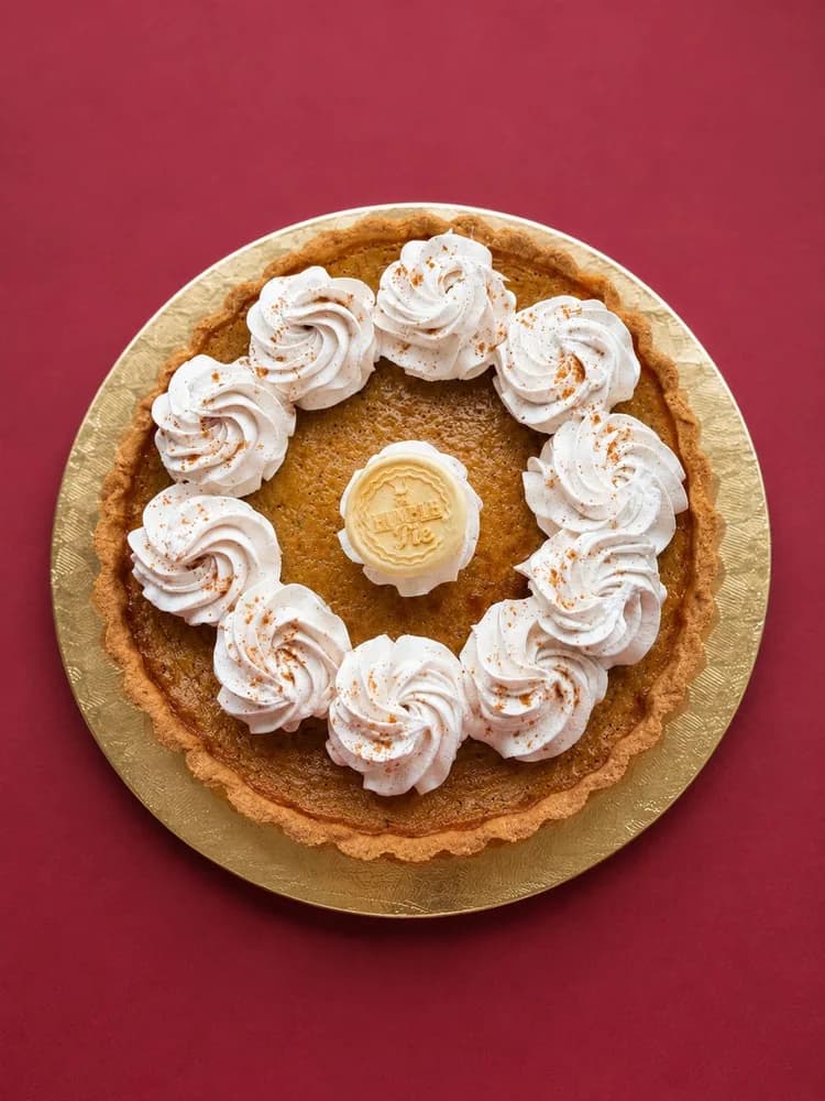 Butterscotch tart with piped cream and The Humble Pie seal
