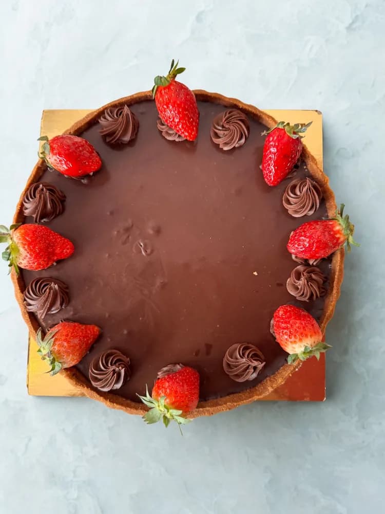 Chocolate tart ringed with fresh strawberries