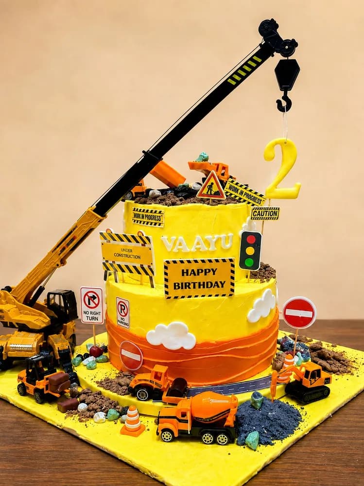 Two tier construction site cake with diggers