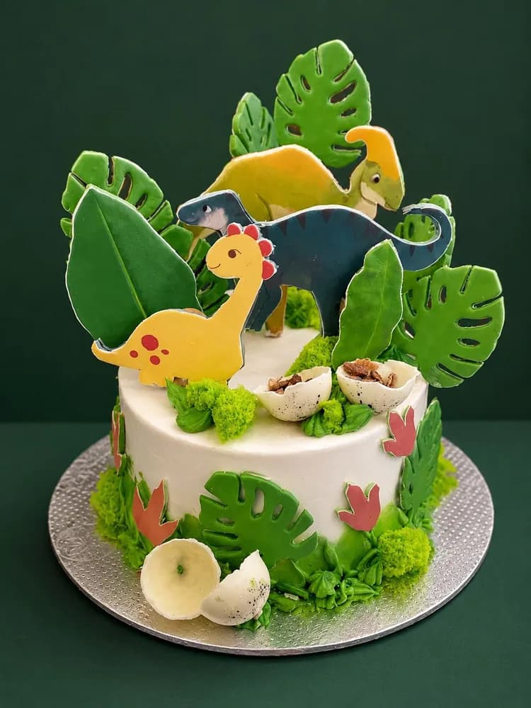 Dinosaur themed cake with fondant leaves