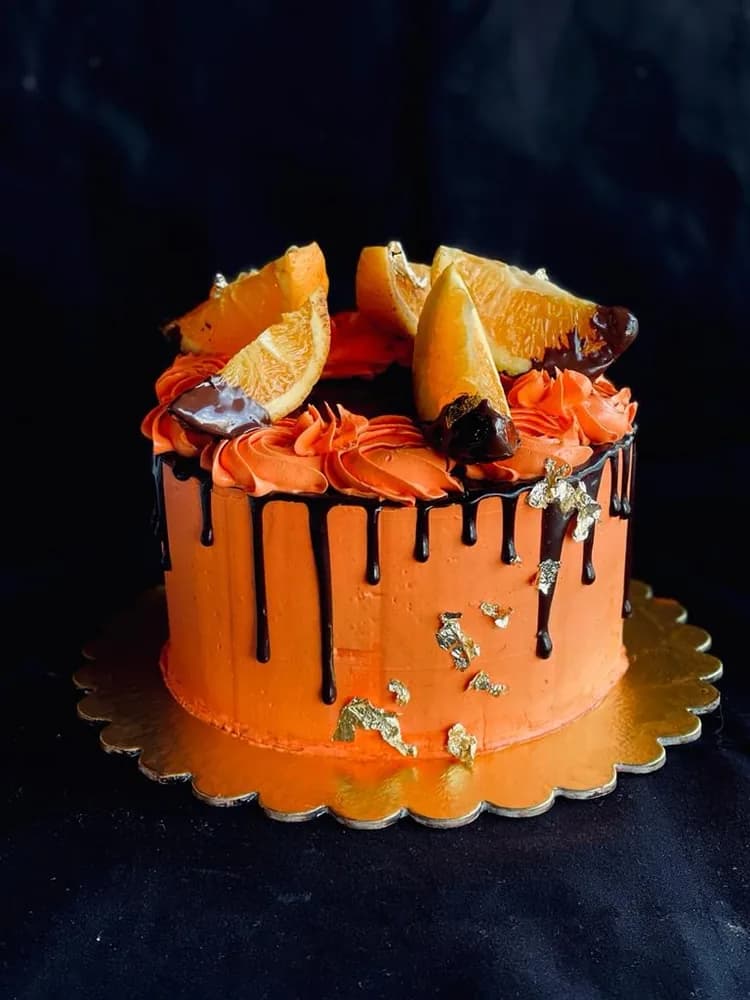Orange buttercream cake with dark chocolate drip