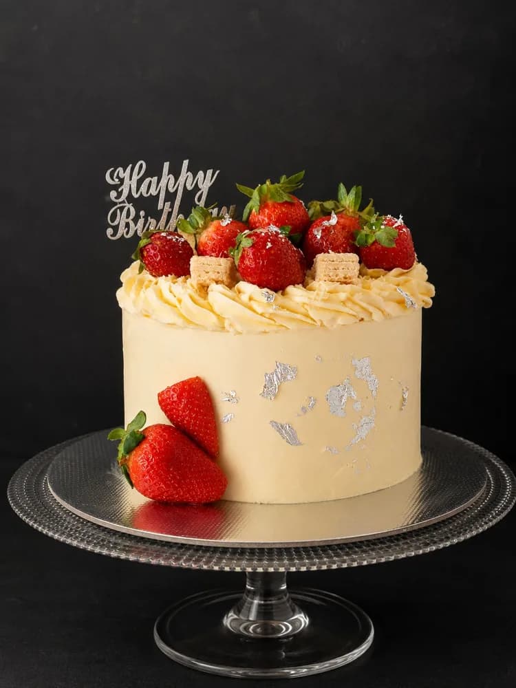 Strawberry buttercream birthday cake with silver leaf